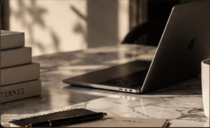 Desk with notebooks and laptop